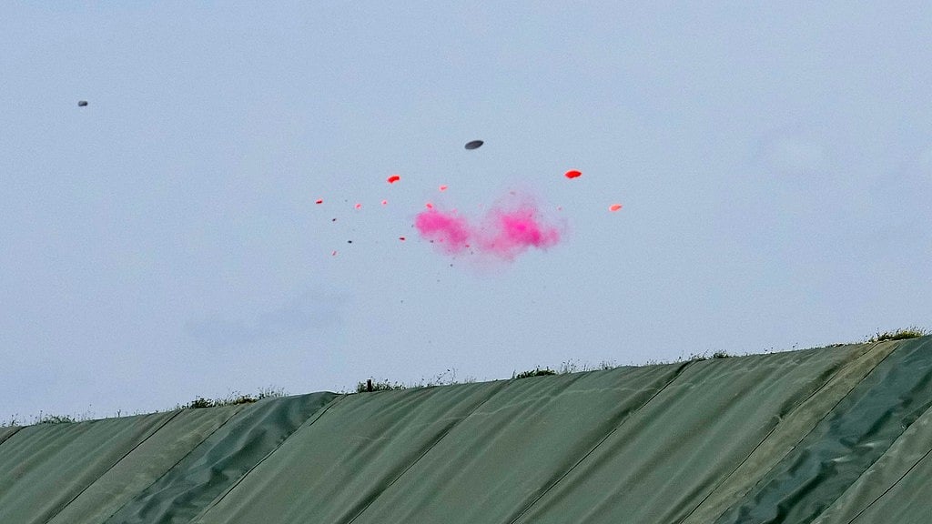 AP/Manish Swarup : A target is shattered by a shot from Britain's Nathan Hales in the Trap men's final at the 2024 Summer Olympics, Tuesday, July 30, 2024, in Chateauroux, France. Hales went on to win the gold medal.